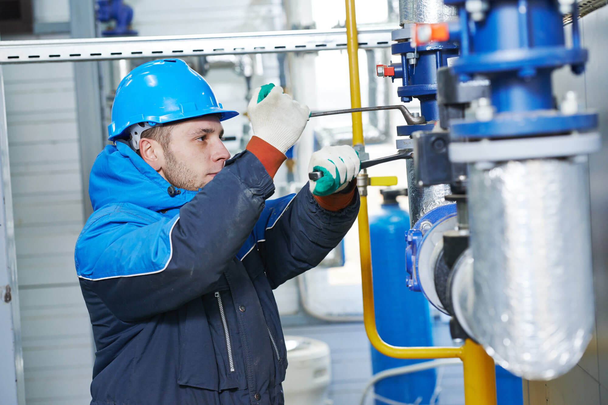 Heating system technician in boiler room